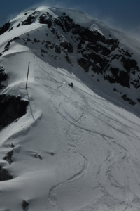 snowboarder hiking on blackcomb glacier
